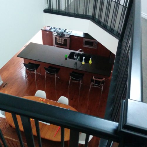 View of kitchen from upstairs. Side 1.